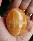 Orange calcite pocket stone 12 new