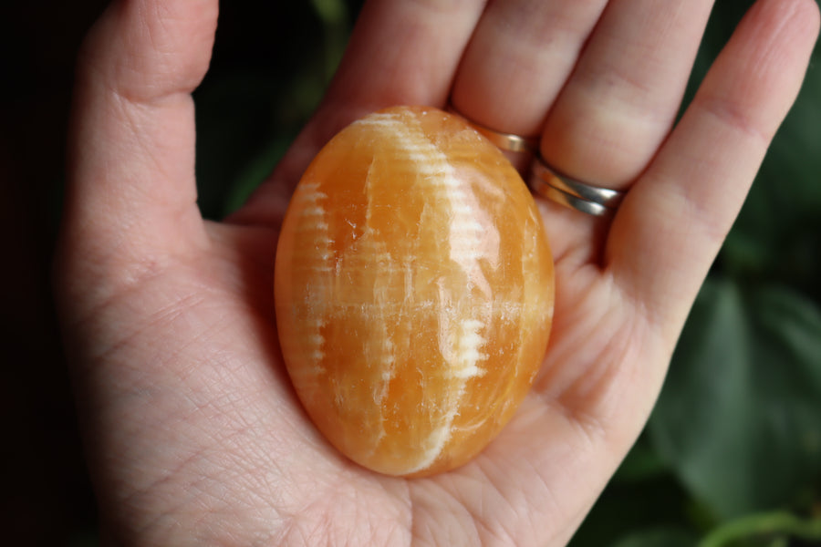 Orange calcite pocket stone 12 new