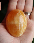 Orange calcite pocket stone 12 new