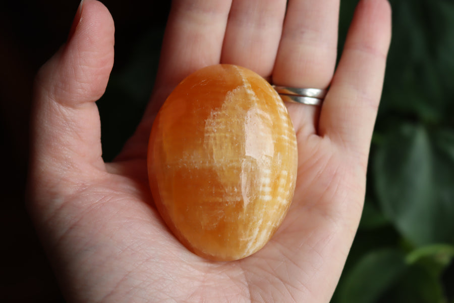 Orange calcite pocket stone 12 new