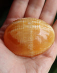 Orange calcite pocket stone 12 new