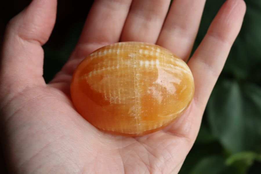 Orange calcite pocket stone 12 new