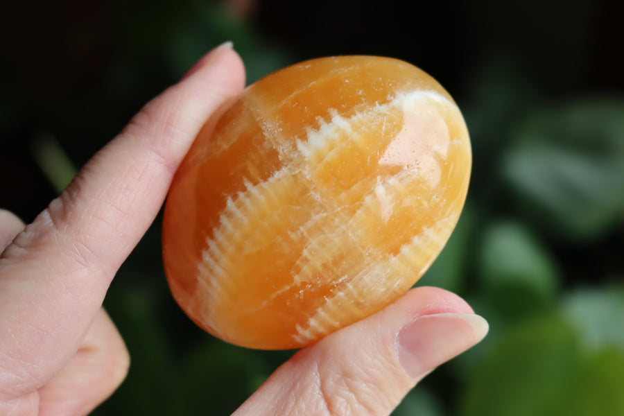 Orange calcite pocket stone 12 new