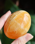 Orange calcite pocket stone 12 new