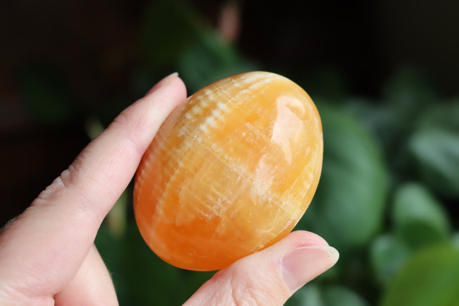 Orange calcite pocket stone 12 new