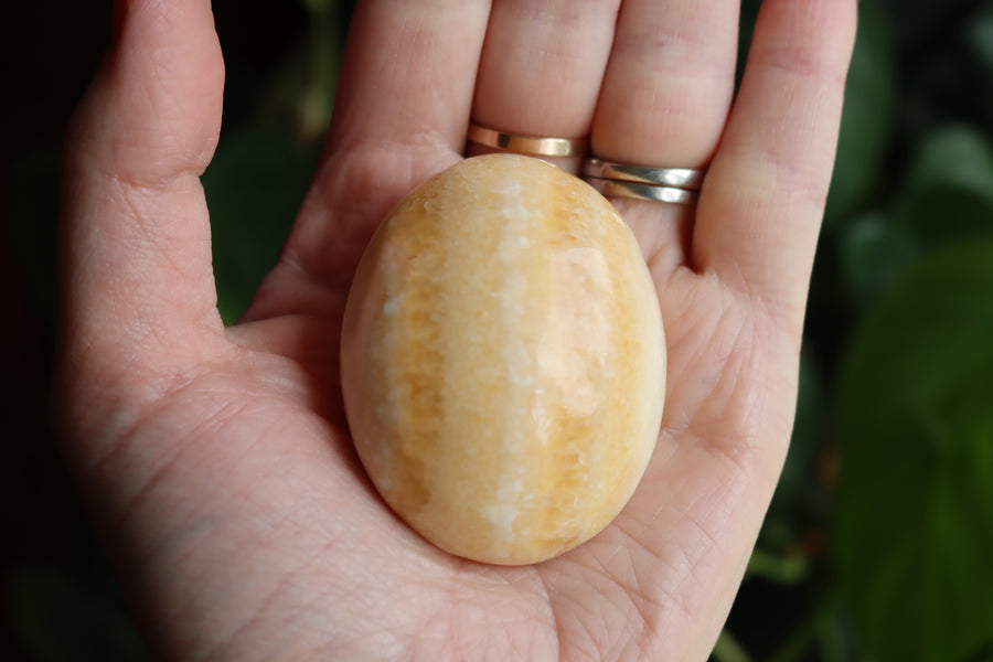 Orange calcite pocket stone 13 new