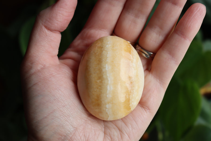 Orange calcite pocket stone 13 new