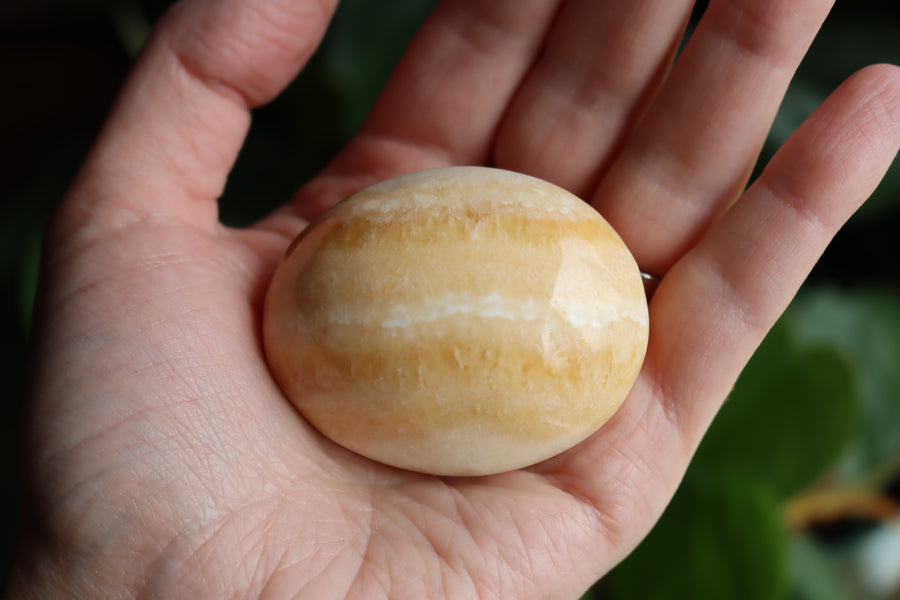 Orange calcite pocket stone 13 new