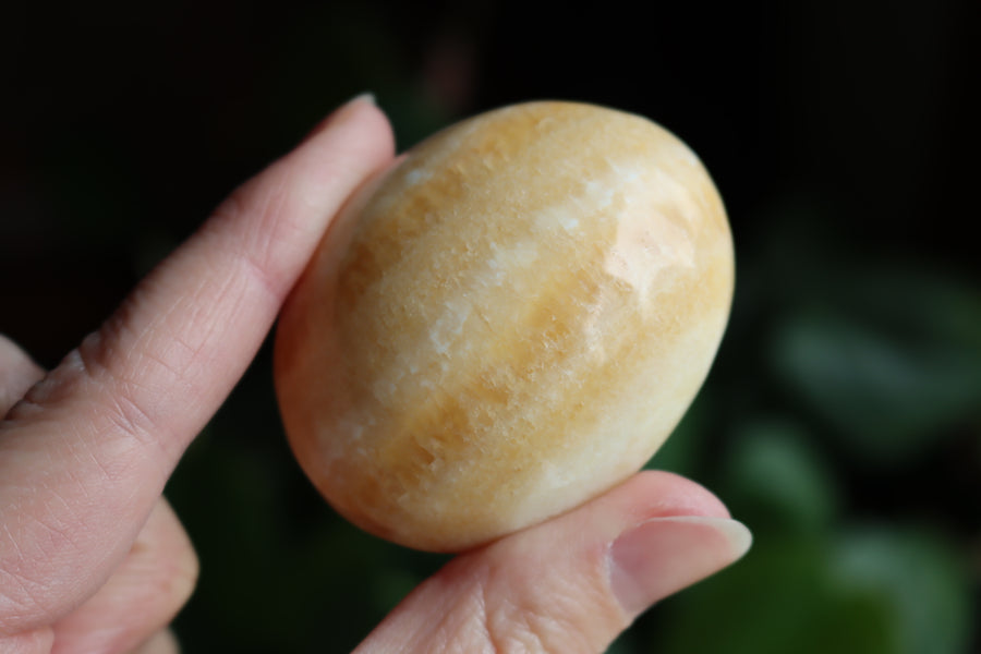 Orange calcite pocket stone 13 new