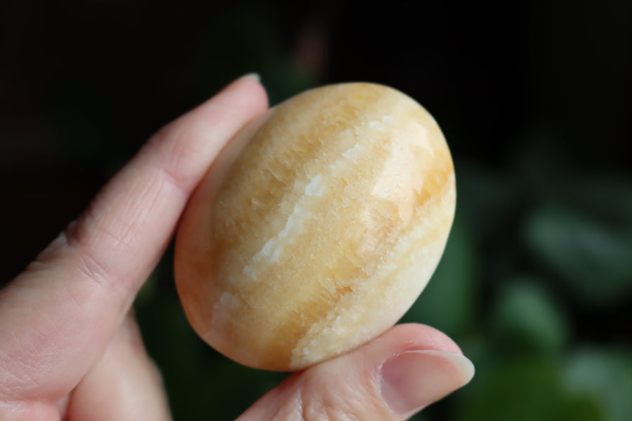 Orange calcite pocket stone 13 new