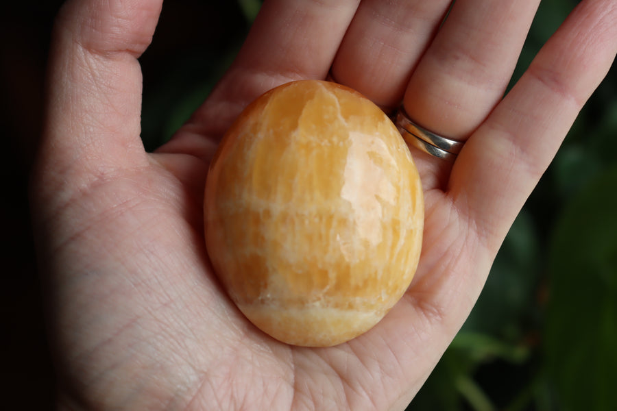 Orange calcite pocket stone 14 new