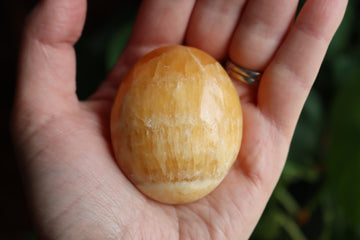 Orange calcite pocket stone 14 new