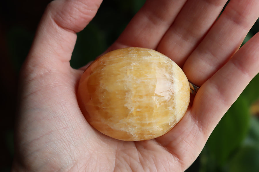 Orange calcite pocket stone 14 new