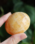 Orange calcite pocket stone 14 new