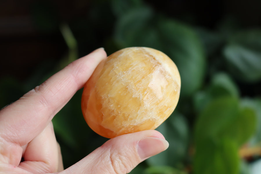 Orange calcite pocket stone 14 new