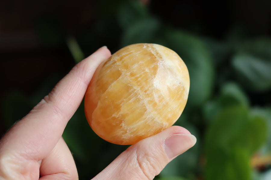 Orange calcite pocket stone 14 new