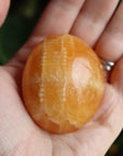 Orange calcite pocket stone 15 new