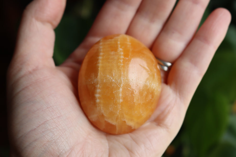 Orange calcite pocket stone 15 new