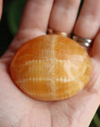 Orange calcite pocket stone 15 new