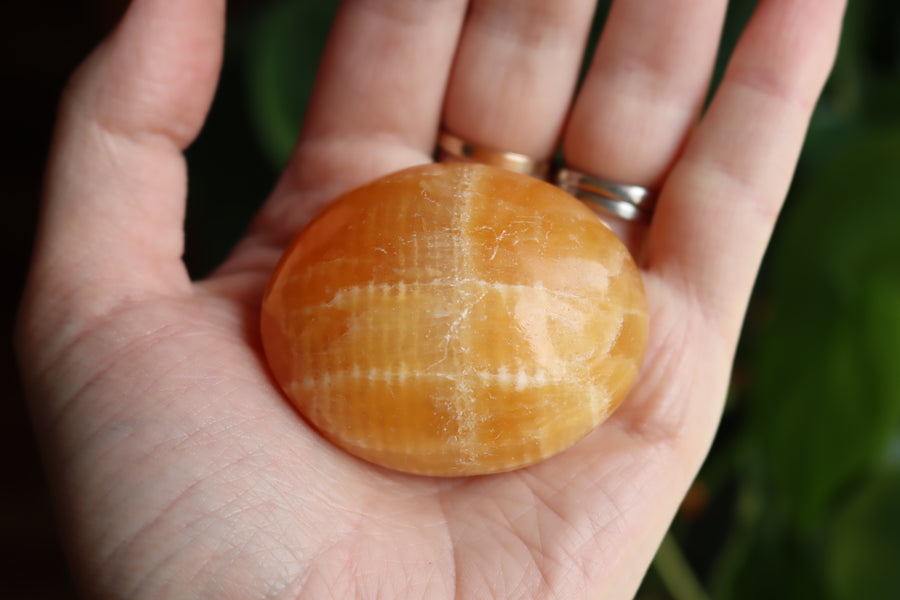 Orange calcite pocket stone 15 new