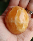 Orange calcite pocket stone 15 new