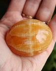 Orange calcite pocket stone 15 new