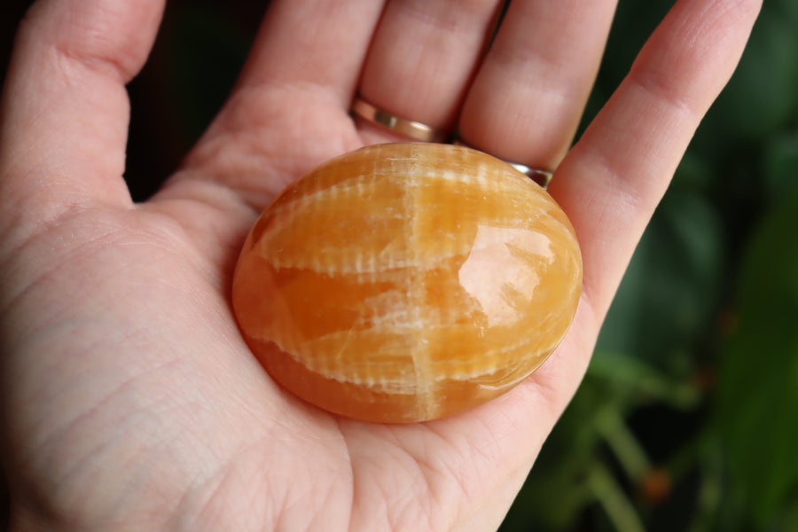 Orange calcite pocket stone 15 new