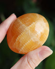 Orange calcite pocket stone 15 new