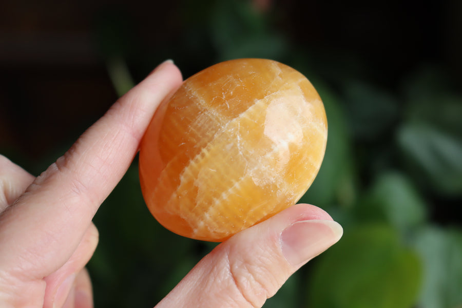 Orange calcite pocket stone 15 new