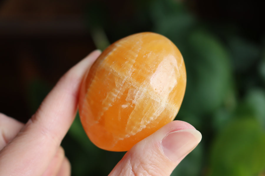 Orange calcite pocket stone 15 new