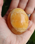 Orange calcite pocket stone 16 new