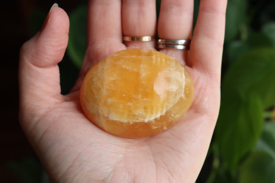 Orange calcite pocket stone 16 new