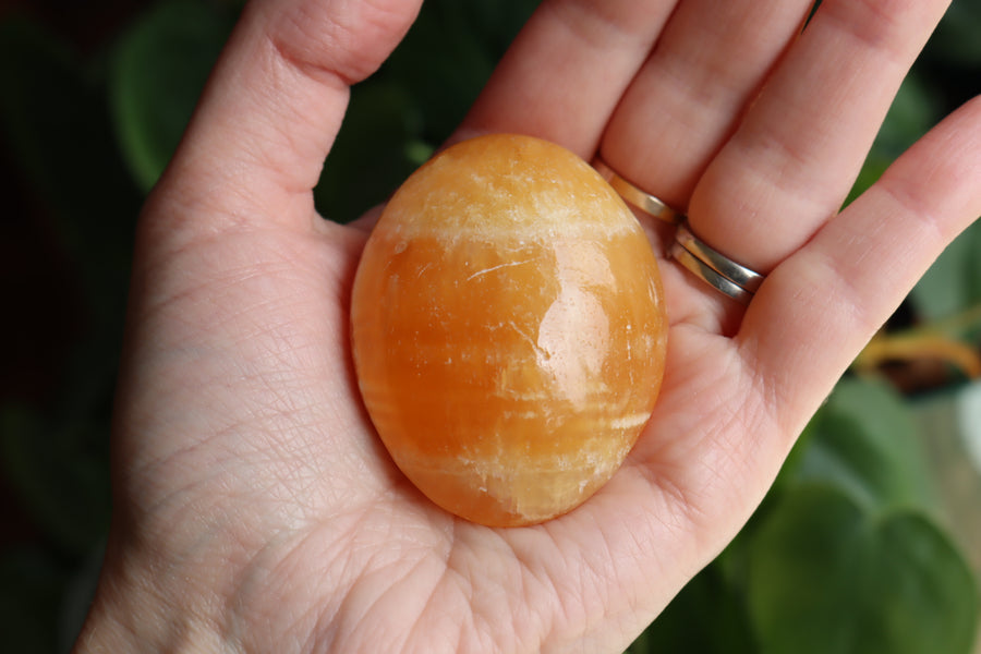 Orange calcite pocket stone 16 new