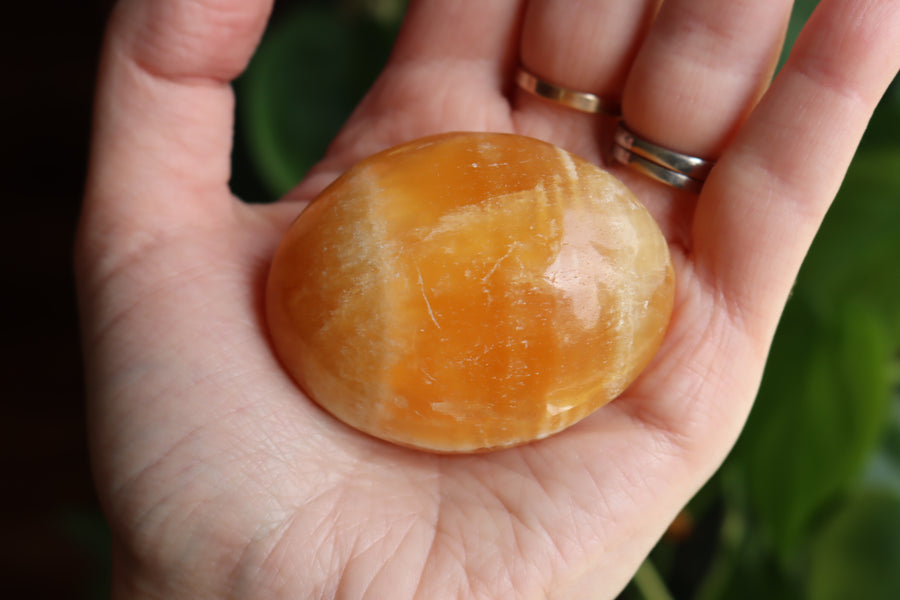 Orange calcite pocket stone 16 new