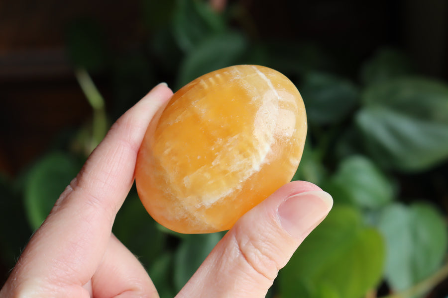 Orange calcite pocket stone 16 new