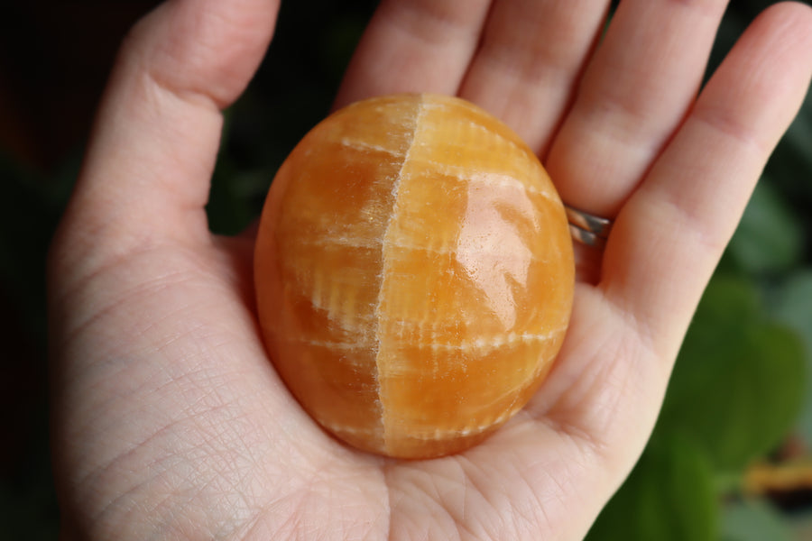 Orange calcite pocket stone 17 new