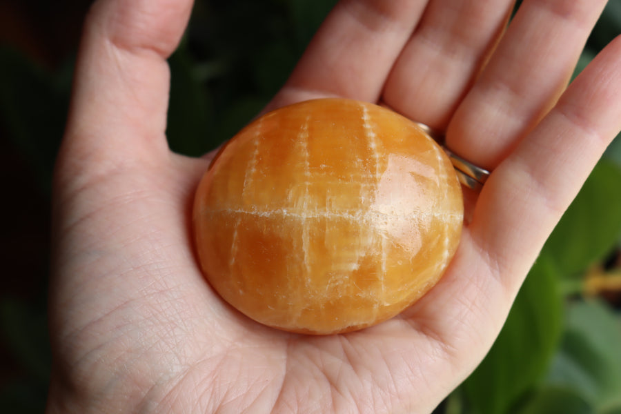 Orange calcite pocket stone 17 new