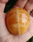 Orange calcite pocket stone 17 new