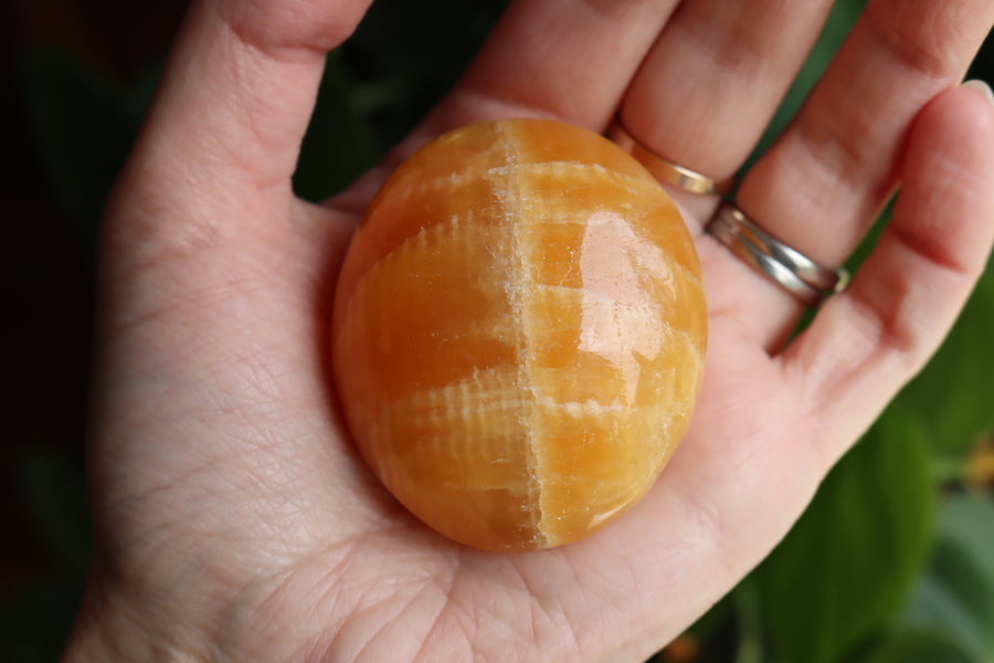 Orange calcite pocket stone 17 new