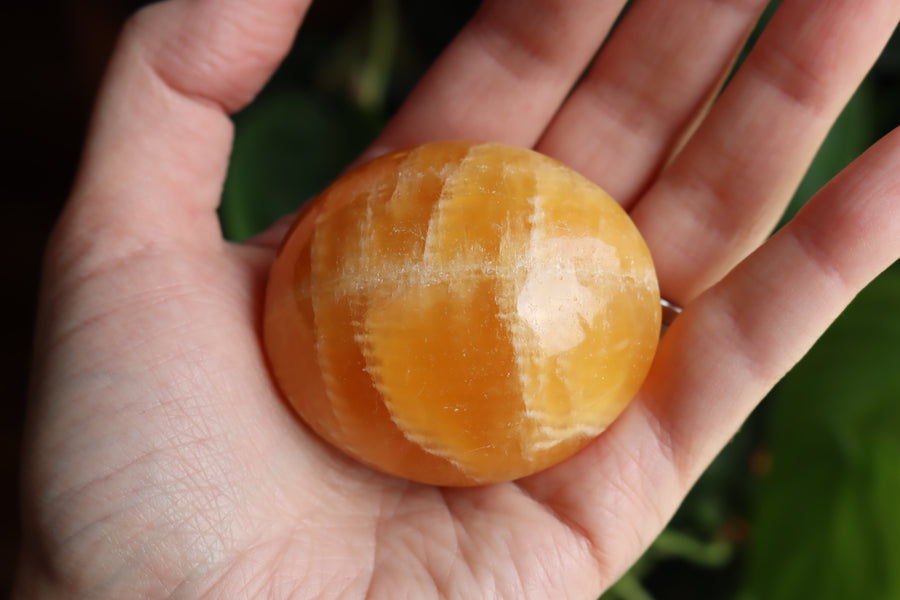 Orange calcite pocket stone 17 new