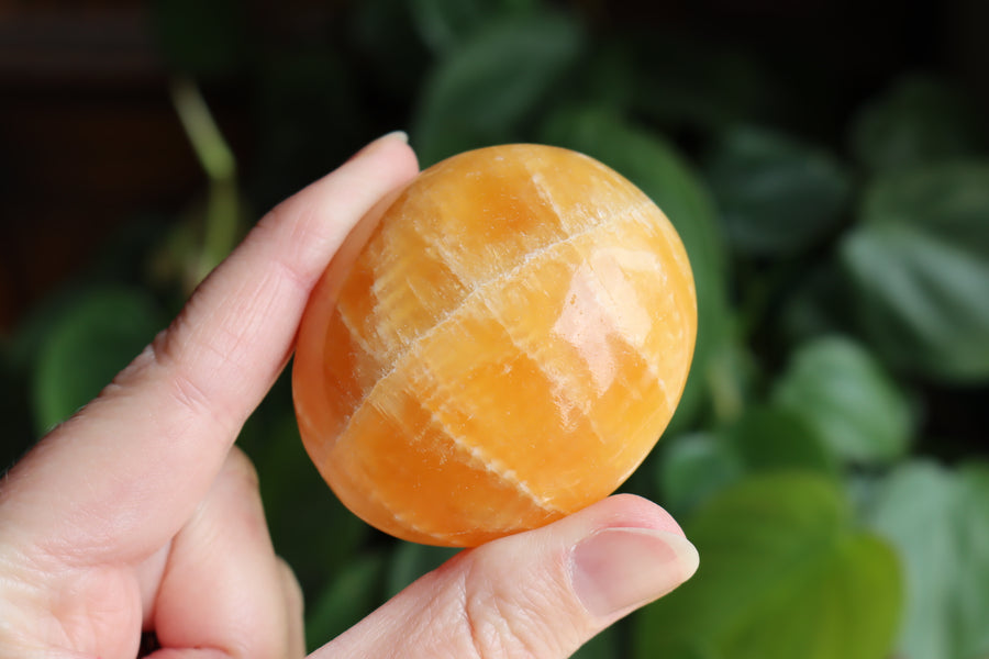 Orange calcite pocket stone 17 new