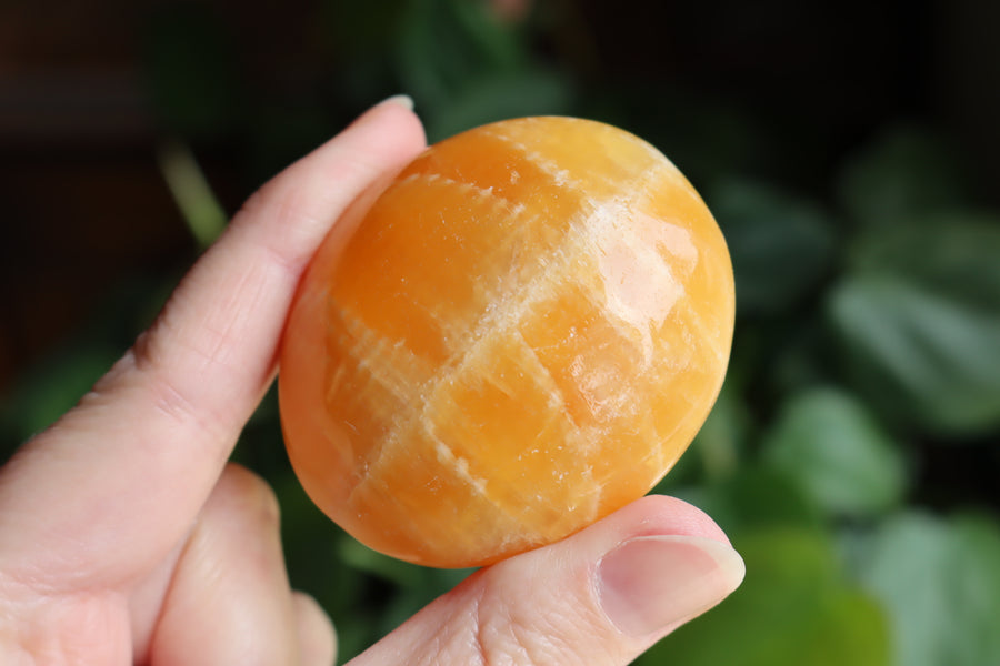 Orange calcite pocket stone 17 new